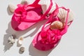 Fashionable sandals, seashells on white background, top view, flat lay.summer pink Shoes for kids, Children`s slippers Royalty Free Stock Photo