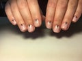 fashionable light manicure and points on short nudity Royalty Free Stock Photo