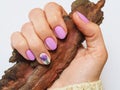 Fashionable lilac manicure design on your hand. Royalty Free Stock Photo