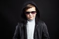 Fashionable little boy in hoodie and sunglasses Royalty Free Stock Photo