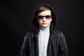 Fashionable little boy in hoodie and sunglasses Royalty Free Stock Photo