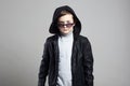 Fashionable little boy in hoodie and sunglasses Royalty Free Stock Photo