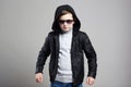 Fashionable little boy in hoodie and sunglasses Royalty Free Stock Photo