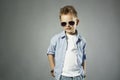 Fashionable little boy in sunglasses.stylish kid in jeans Royalty Free Stock Photo