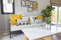 Fashionable living room interior with yellow and blue accents. Royalty Free Stock Photo