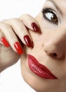 Fashionable makeup and manicure in dark red and light shades of nail Polish. Royalty Free Stock Photo