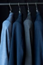 fashionable male suit jackets on hangers Royalty Free Stock Photo