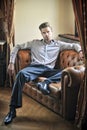 Fashionable man sitting Royalty Free Stock Photo