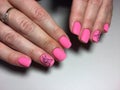 fashionable matte pink manicure with abstraction