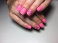 fashionable matte pink manicure with abstraction