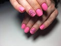 fashionable matte pink manicure with abstraction