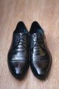 Fashionable mens black shoes on a floor