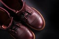 Fashionable mens leather brown shoes on black background. . Men's high boots. Top view. Copy space.