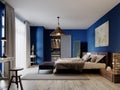 Fashionable modern loft style bedroom with blue walls and rustic furniture Royalty Free Stock Photo