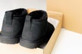 Fashionable modern short UGG boots made of sheep fur for the winter. Royalty Free Stock Photo