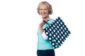 Fashionable old lady with shopping bag Royalty Free Stock Photo