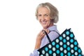 Fashionable old lady with shopping bag Royalty Free Stock Photo