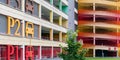 Fashionable parking lot construction with coloured signs