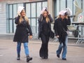 MILAN - FEBRUARY 22, 2018: Fashionable woman walking in the street after LES COPINS fashion show Royalty Free Stock Photo