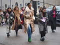 MILAN - FEBRUARY 22, 2018: Fashionable people walking in the street after LES COPINS fashion show Royalty Free Stock Photo