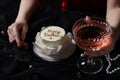 Fashionable photo of woman with her Birthday cake and glass of wine on black background, closeup Royalty Free Stock Photo