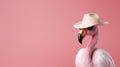 Fashionable pink flamingo in hat and sunglasses on blurred background with copy space
