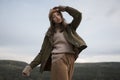 Fashionable portrait of beautiful girl in autumn outdoor