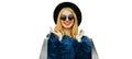 Fashionable portrait stylish blonde woman with two shopping bags wearing a blue faux fur coat, black round hat on colorful