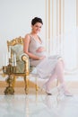 Fashionable pregnancy. Future mother in an expensive interior Royalty Free Stock Photo