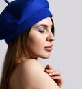 Fashionable pretty modern young french woman with sexy lips in a stylish blue elegant beret hat closeup portrait Royalty Free Stock Photo