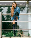 Fashionable pretty young woman wearing striped knee socks Royalty Free Stock Photo