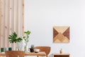 Fashionable scandinavian wooden design in bright living room interior