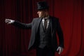 Fashionable showman or illusionist in tailcoat and top hat on stage