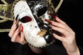 Fashionable stilettos nails design with Venetian buffoon mask