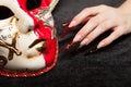 Fashionable stilettos nails design with Venetian buffoon mask