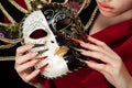 Fashionable stilettos nails design with Venetian buffoon mask