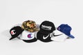 Fashionable Stussy, Thrasher, Supreme, Champion and Nike baseball caps isolated on white background