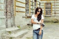 Fashionable stylish girl with old camera wearing sunglasses and