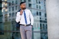 Fashionable stylish modern African american businessman corporate executive entrepreneur model, commercial lifestyle portrait down