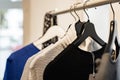 Fashionable stylish women`s clothing on a hanger. Close-up of branded clothing in a show room. Light background. Fashion retail Royalty Free Stock Photo