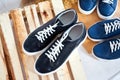 Fashionable suede sneakers. Sport shoes. Expensive footwear or loafers on white background with different thing