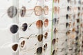 fashionable sunglasses on the shop shelf. Royalty Free Stock Photo