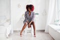 Fashionable tall african american model woman with red afro hair in dress Royalty Free Stock Photo