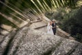 Fashionable wedding couple near Catholic church. Bride and Groom. Outdoor portrait