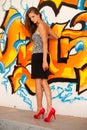 Fashionable woman with blured graffitti in background Royalty Free Stock Photo