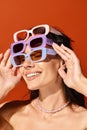 A fashionable woman donning sunglasses and