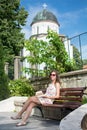 Fashionable woman in front of a church Royalty Free Stock Photo