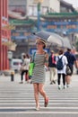 Fashionable woman with parasol, Beijing, China