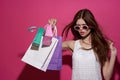 fashionable woman shopping entertainment lifestyle pink background Royalty Free Stock Photo