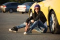Fashion woman in sunglasses sitting on car parking